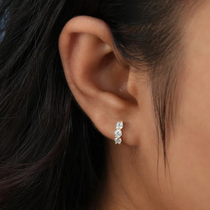 925 sterling silver moissanite hoop earrings with round cut stones in white and yellow gold finish