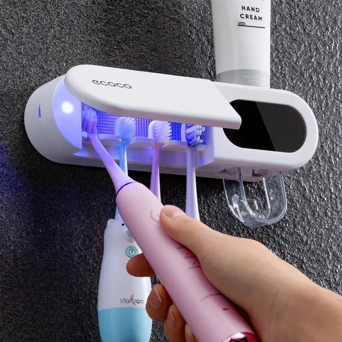 Modern wall-mounted toothbrush holder with 4 magnetic cups, built-in toothpaste dispenser, and LED display showing time and temperature