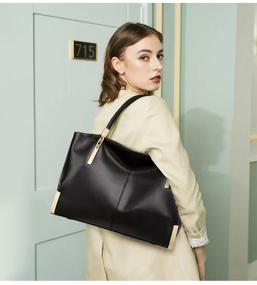 Split leather women’s tote bag with dual handles, multiple interior compartments, and soft casual design for everyday use.