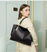 Split leather women’s tote bag with dual handles, multiple interior compartments, and soft casual design for everyday use.