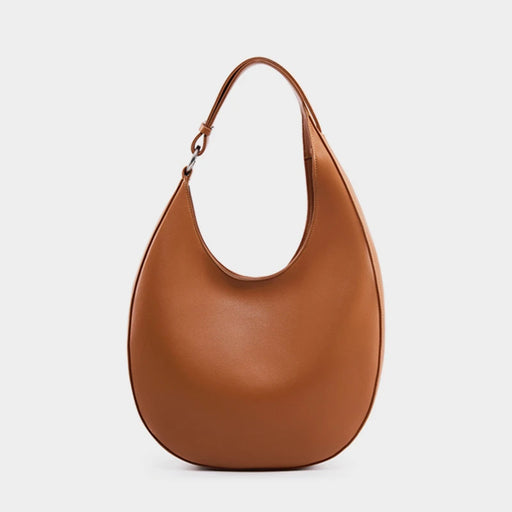 Genuine cow leather women’s half-moon shoulder bag with interior pockets, soft and fashionable for everyday use