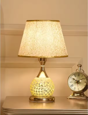 Crystal desk lamp providing soft ambient lighting on bedside table