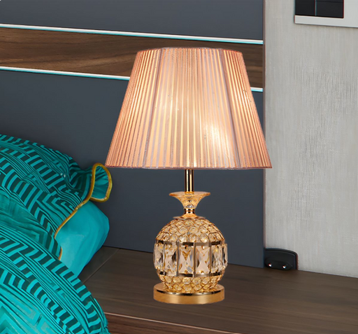 Contemporary gold pineapple nightstand lamp with faceted crystal and pink barrel shade