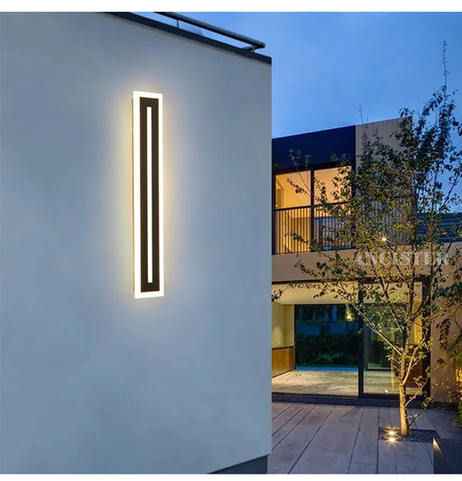 Modern waterproof long strip LED wall light for outdoor courtyard or indoor hallway.
