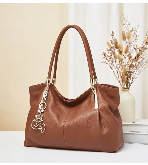 FOXER genuine leather women’s shoulder bag with zipper closure, interior compartments, beading and sequins, soft casual tote.