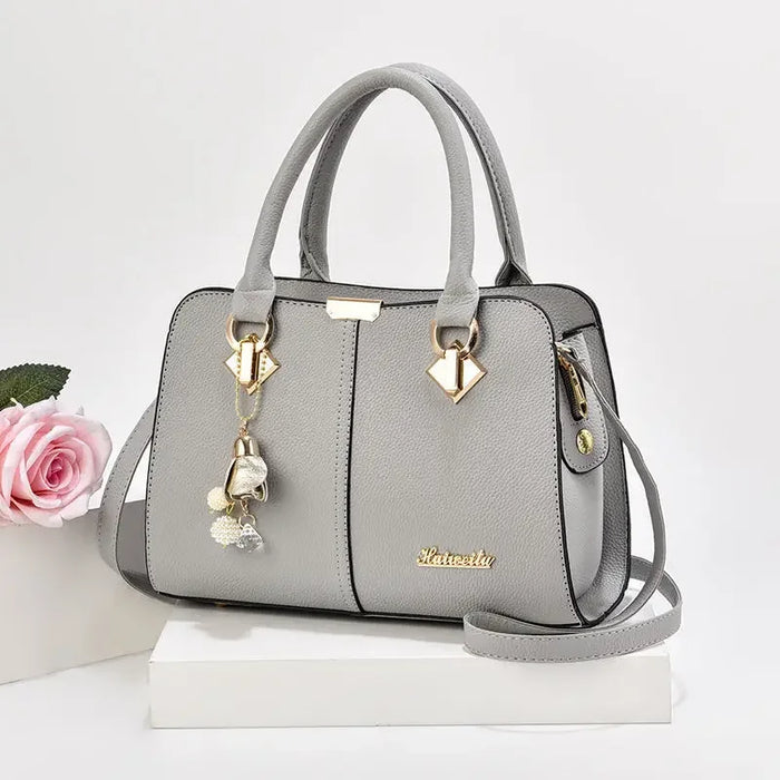 Women’s PU leather Boston handbag with large capacity and structured design
