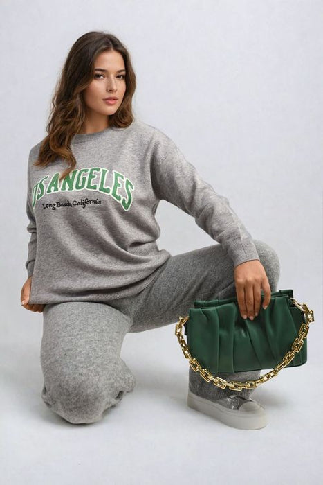 Women’s knitted jumper with Los Angeles graphic, long sleeves, and one-size fit in black, grey, and beige