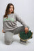Women’s knitted jumper with Los Angeles graphic, long sleeves, and one-size fit in black, grey, and beige