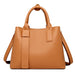 Luxury designer tote handbag in PU leather with structured design, zipper & hasp closure, and multiple interior pockets.
