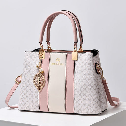 Spacious PU leather tote handbag in casual style with crossbody strap and top handles, ideal for everyday use.
