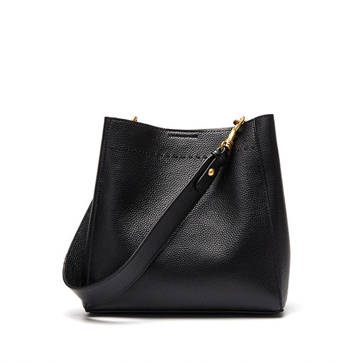 Genuine leather bucket handbag in black or brown with soft structure, hasp closure, and multiple storage compartments.