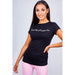 Model wearing black “Sweet But Psycho” slogan tee with relaxed fit