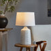 Modern ceramic table lamp with abstract grey and white glaze and ivory linen shade