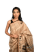 Handwoven Tussar Silk Saree with Warli tribal art showcasing geometric motifs and traditional Indian designs