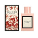 Gucci Bloom Eau de Parfum 50ml bottle, showcasing its pale pink lacquer and floral label.   
