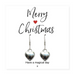 Pair of silver heart shaped drop earrings with Sterling Silver plated, nickel-free hooks, displayed on a "Merry Christmas" message card inside a black box.