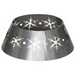 Silver metal Christmas tree collar featuring a detailed snowflake pattern, shown covering a tree base for a neat and festive holiday display.