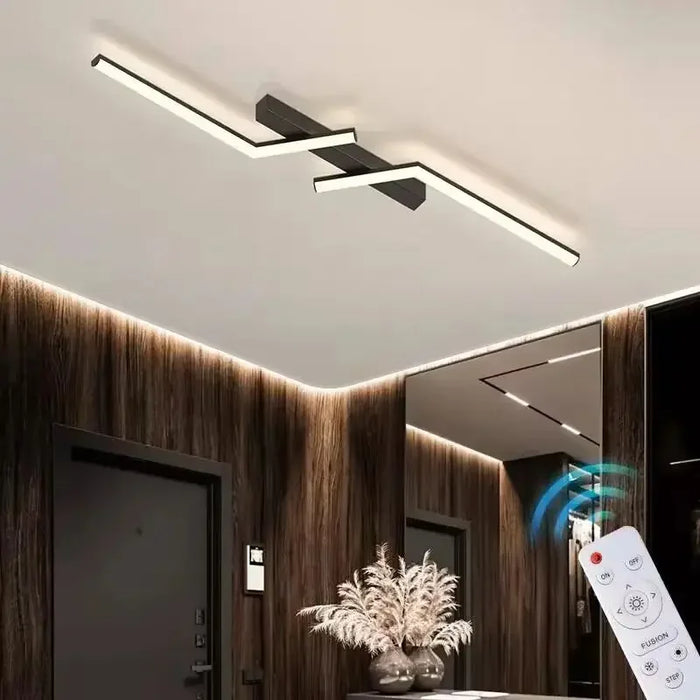 Modern LED line ceiling lamp with sleek strip design illuminating a stylish indoor space