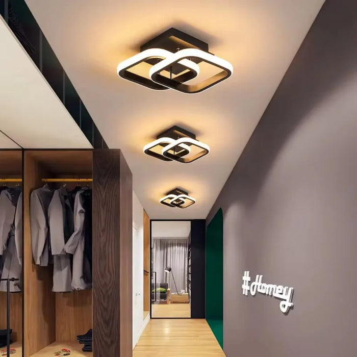 Modern round LED ceiling light with black aluminum body and acrylic shade