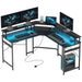 Modern black multi-level workstation with USB-C, LED lighting, and monitor shelf