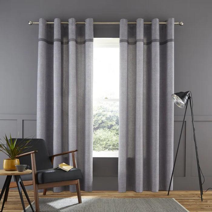Soft shade curtains with contrasting border in neutral tones