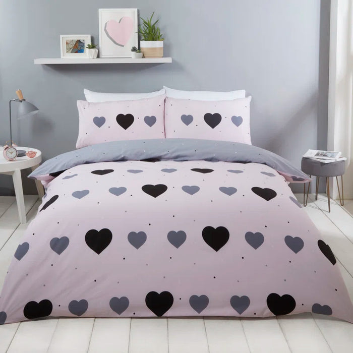 Charming reversible cotton-blend bedding set with hearts on pink and polka dot reverse side