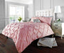 Cotton blend geometric duvet cover set with matching pillowcases in modern bedroom

