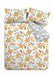 Modern duvet cover set with soft teal and ochre leaf print, complementing tonal leaf reverse.