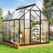 Greenhouse with durable aluminum frame, UV-coated polycarbonate panels, and adjustable ventilation for optimal plant care.