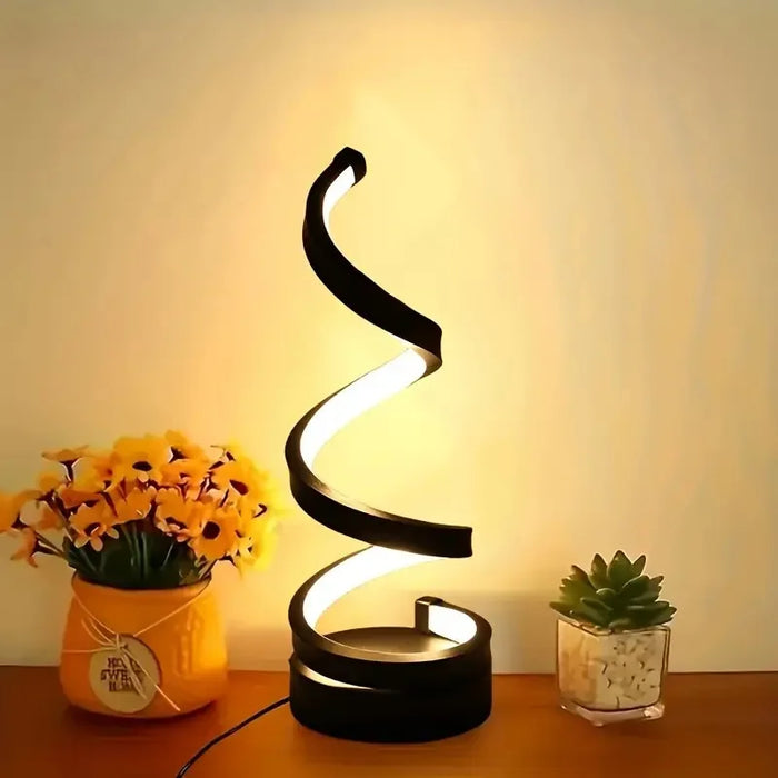 Modern spiral LED table lamp with 3-color dimmable lighting on a bedside table