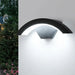 LED wall lamp mounted on outdoor garden wall providing warm waterproof lighting