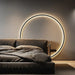Black Nordic style LED wall sconce mounted on a modern interior wall