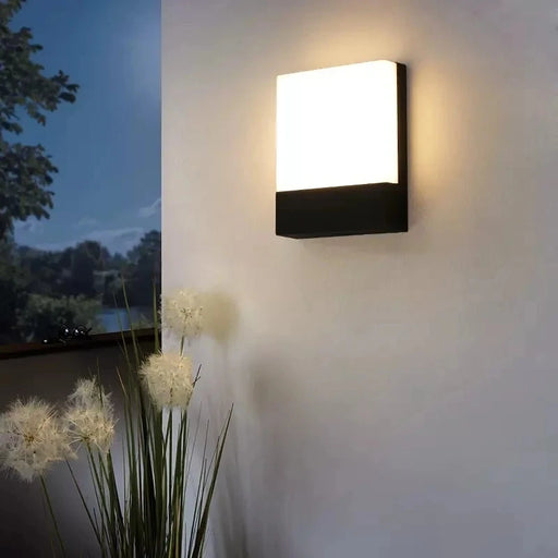 Modern LED wall lamp with IP65 waterproof protection and polished chrome finish for outdoor spaces