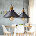 Vintage iron pendant light with rustic industrial design for farmhouse interiors