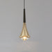 Modern aluminum pendant light hanging over a stylish dining space