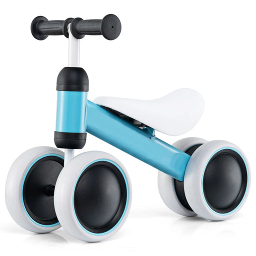 Toddler riding balance bike with comfortable padded seat and non-slip handlebar