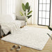 Luxuriously soft cream shag rug with deep pile, perfect for cozy living spaces.

