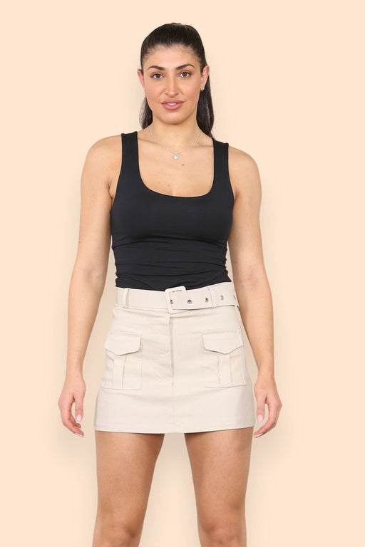 Woman wearing khaki belted cargo skort with utility pockets