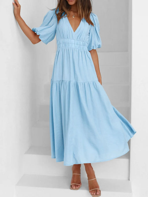 Elegant puff sleeve dress with ruched waist, perfect for formal events and casual wear.