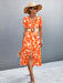 Chic floral midi dress with puff sleeves, V-neckline, and slit hem detail