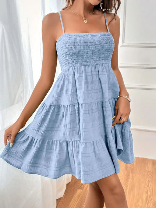 Woman wearing a lightweight casual summer dress made from soft stretchy fabric, ideal for warm weather
