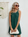 Woman wearing eyelet summer dress with round neckline in lightweight polyester fabric