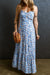 Model wearing ruched ruffle hem printed cami dress with stretchy viscose fabric and ruffle detailing