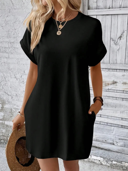 Model wearing round neck short sleeve mini dress in casual summer setting