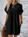 Model wearing round neck short sleeve mini dress in casual summer setting
