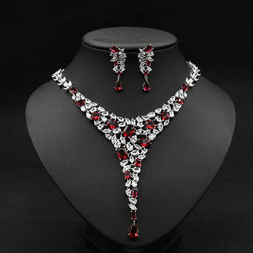 Gold-plated red ruby necklace set with cubic zirconia stones for women, elegant jewelry on white background