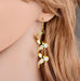 Frosted spiral statement earrings in gold and silver, long lightweight design with subtle shine