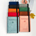 Slim RFID blocking passport holder made from premium PU leather with card and cash compartments