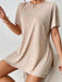 Woman wearing a two-piece lounge set with round neck top and side-slit shorts