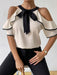 Ruffled Contrast Trim Cold Shoulder Blouse with Feminine Bow Detail